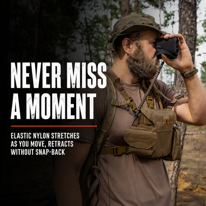 Hunter using a rangefinder tethered with a Lone Trail elastic tether in the field