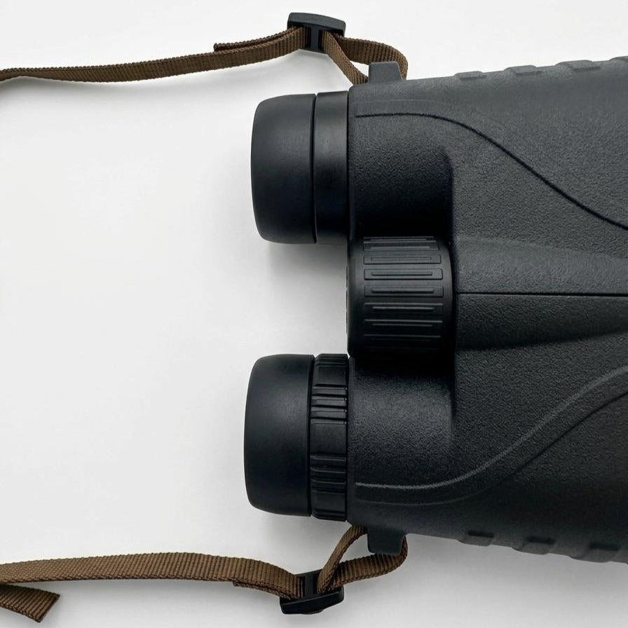 Binocular tethers attached to both sides of a binocular