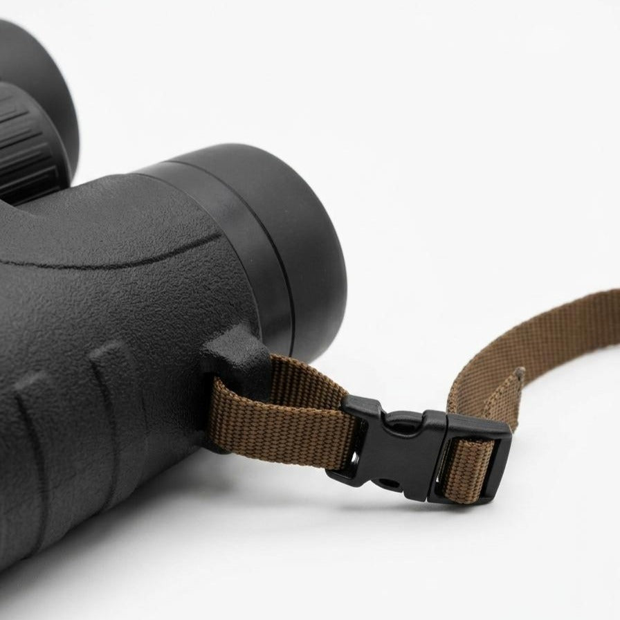 Binocular tether quick-release buckle on the binocular strap lug
