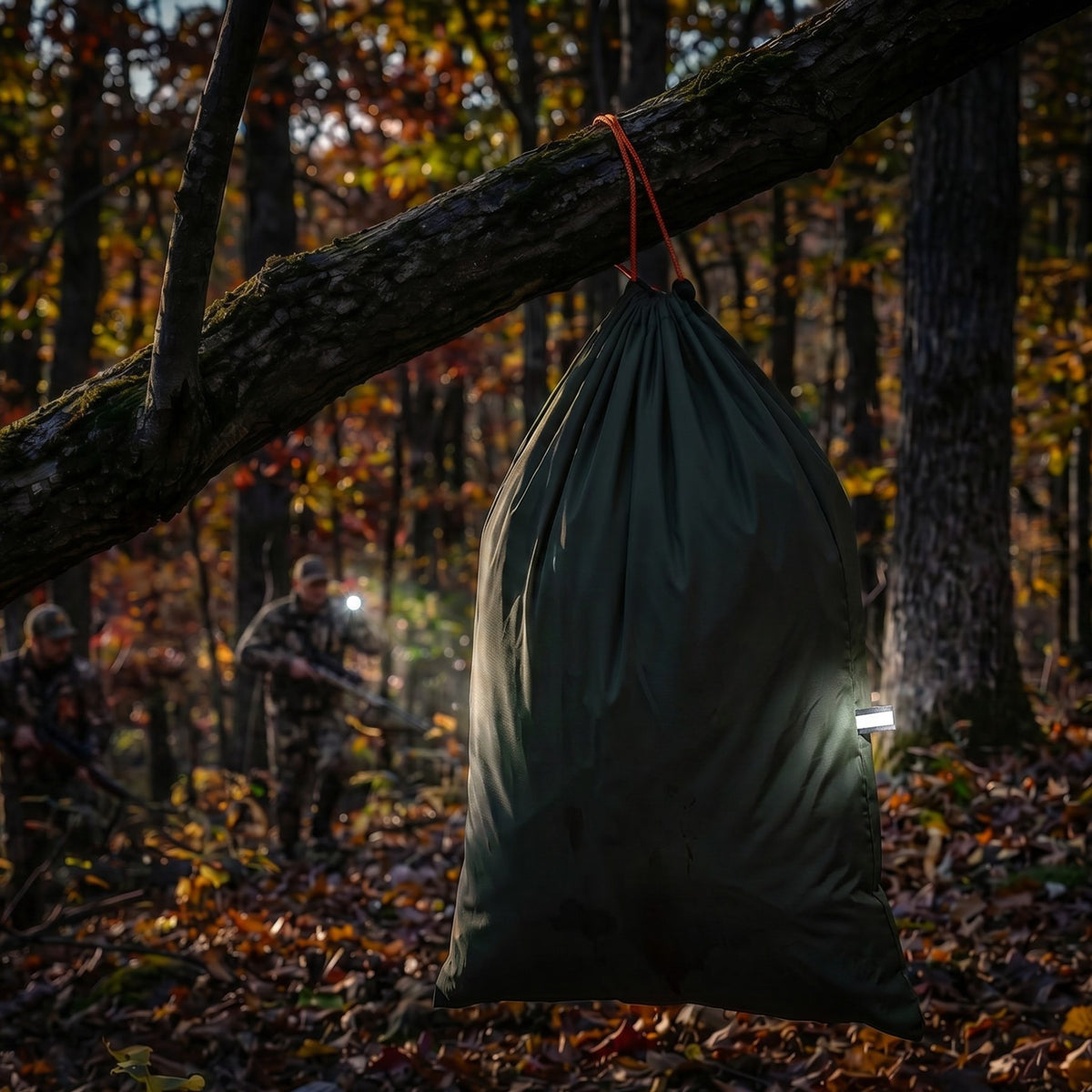 Reflective tab on a hanging game bag under a headlamp