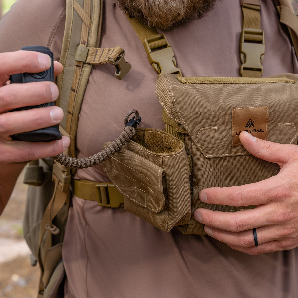 Rangefinder on the tether, clipped to the bino harness